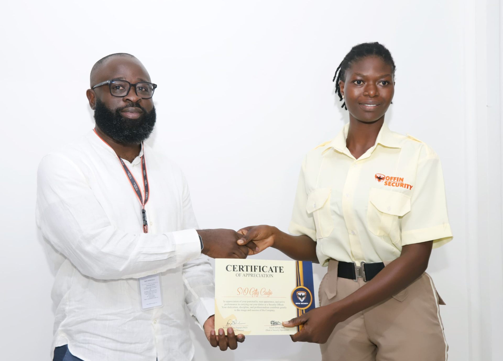 S/O Gifty Cudjo receiving a certificate of appreciation from Offin Security leadership