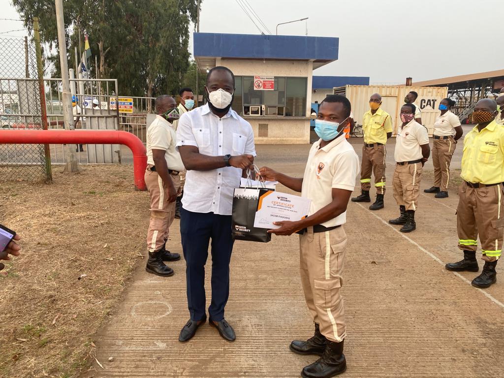 On-site award ceremony at a client location with Offin Security guards lined up