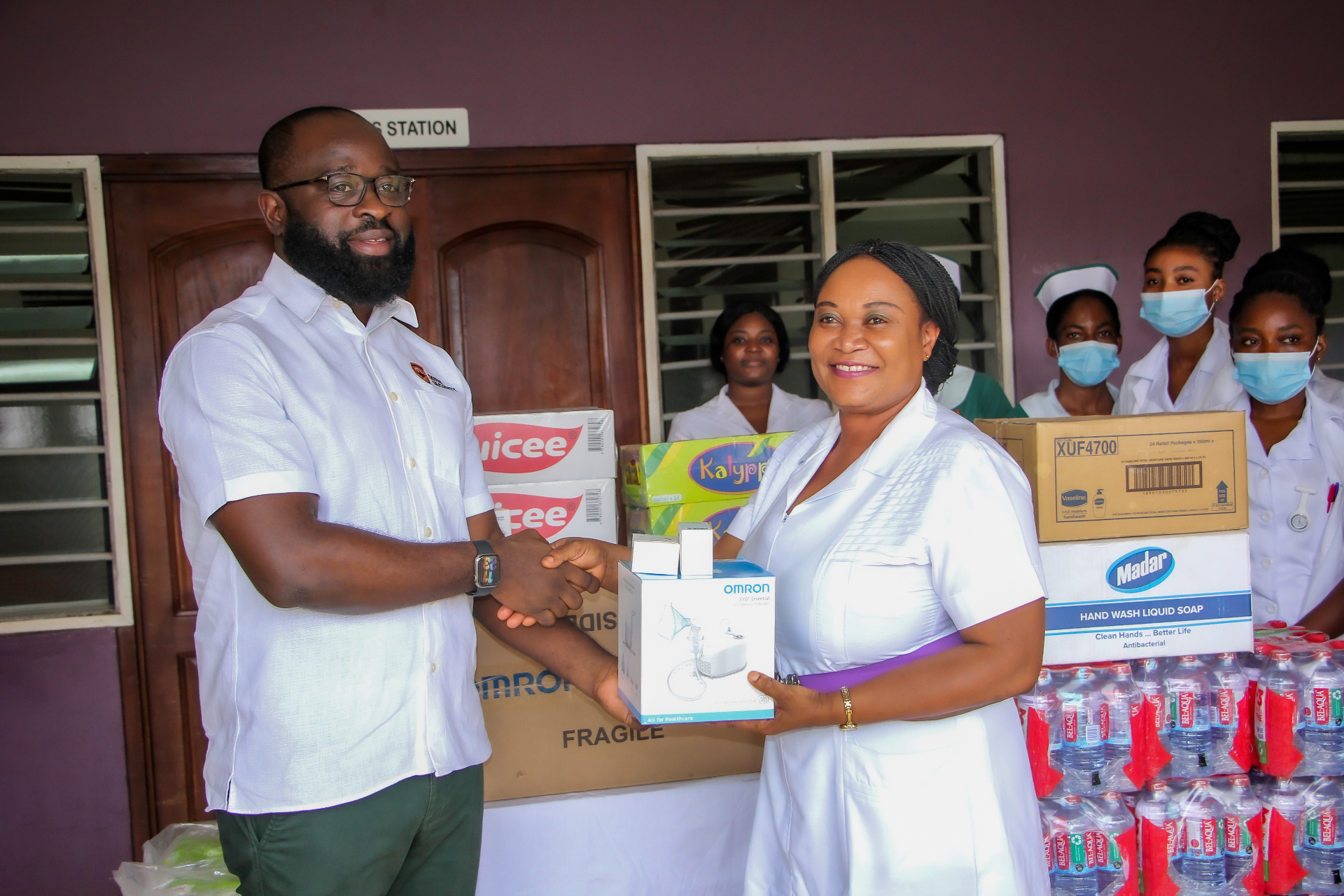 Offin Security representative handing over medical equipment to Achimota Hospital